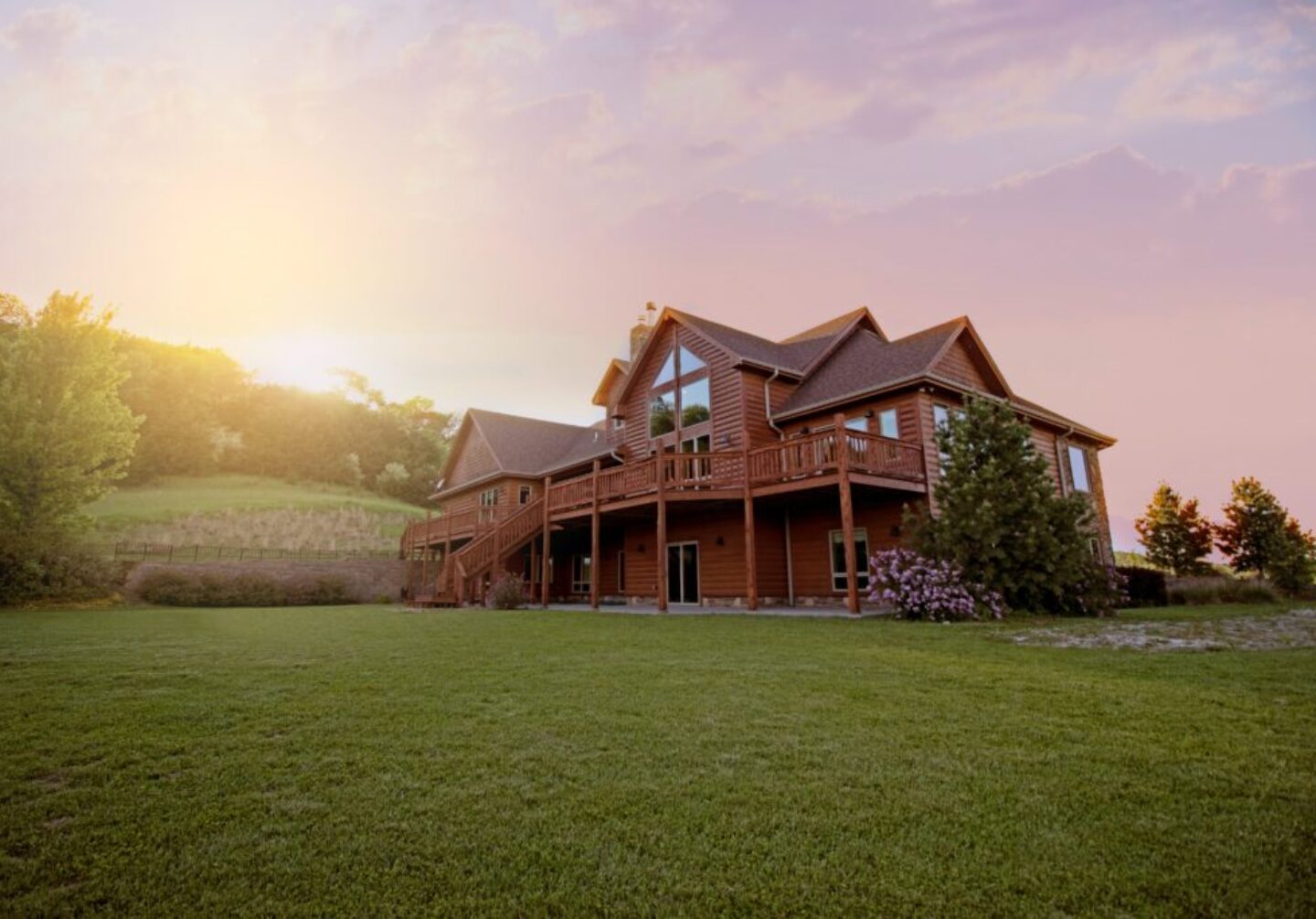 Photo by Bailey Anselme brown wooden house with green grass field