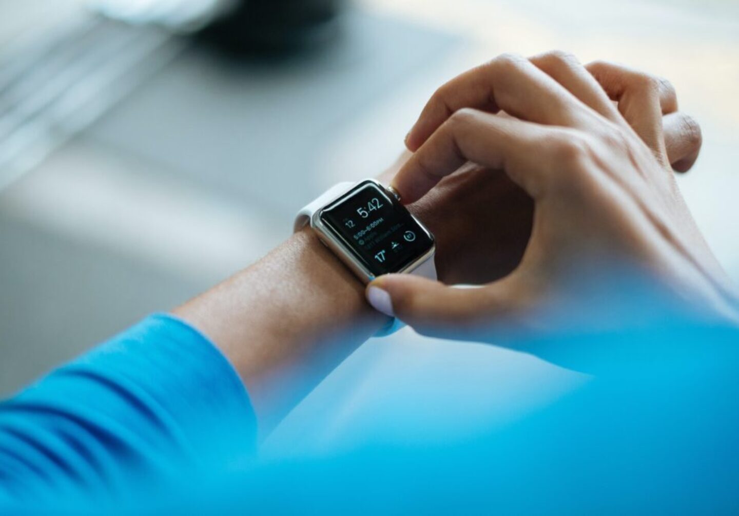 Photo by Luke Chesser person clicking Apple Watch smartwatch