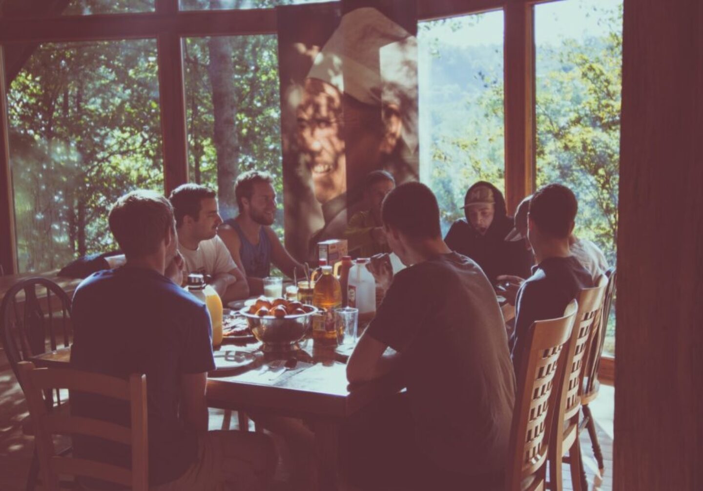 a group of people eating in a restaurant